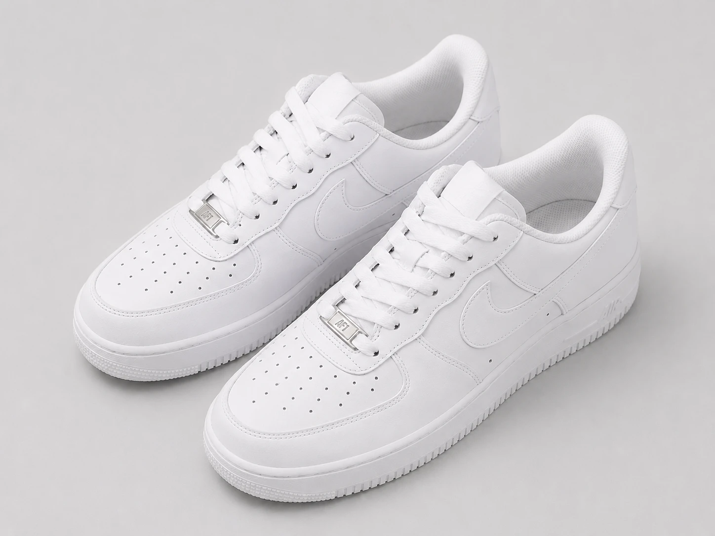 Clean white sneakers product photo with emoji stickers removed